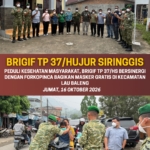 PEDULI KESEHATAN MASYARAKAT, BRIGIF TP 37/HS BERSINERGI DENGAN FORKOPINCA BAGIKAN MASKER GRATIS DI KECAMATAN LAU BALENG